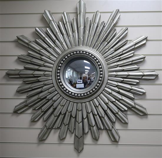 A silver painted starburst wall mirror, H.104cm